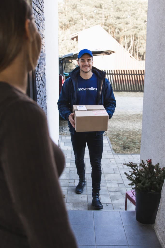 MoveMiles team member at your door with a delivery